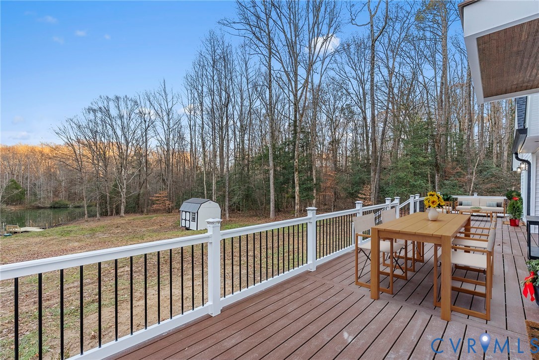 6329 Orchard Road New Kent, VA 23124 - Photo 6 of 25 a view of balcony with furniture and trees