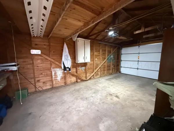 a view of a room with wooden walls