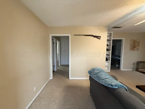 a view of walk in closet with couch