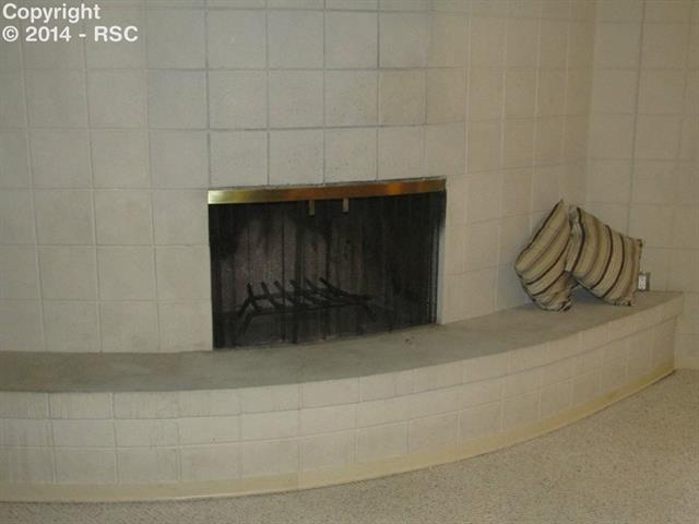 52 Upland Road Colorado Springs, CO 80906 - Photo 9 of 14 Lower level fireplace