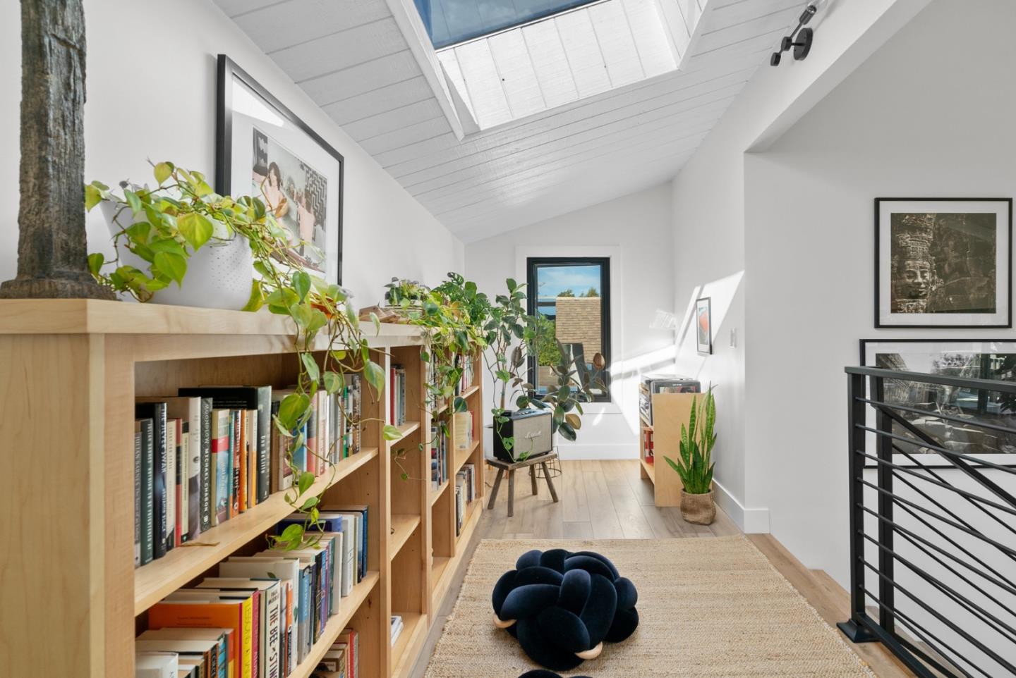 409 Townsend Drive Aptos, CA 95003 - Photo 11 of 43 a living room with lots of furniture and a book shelf