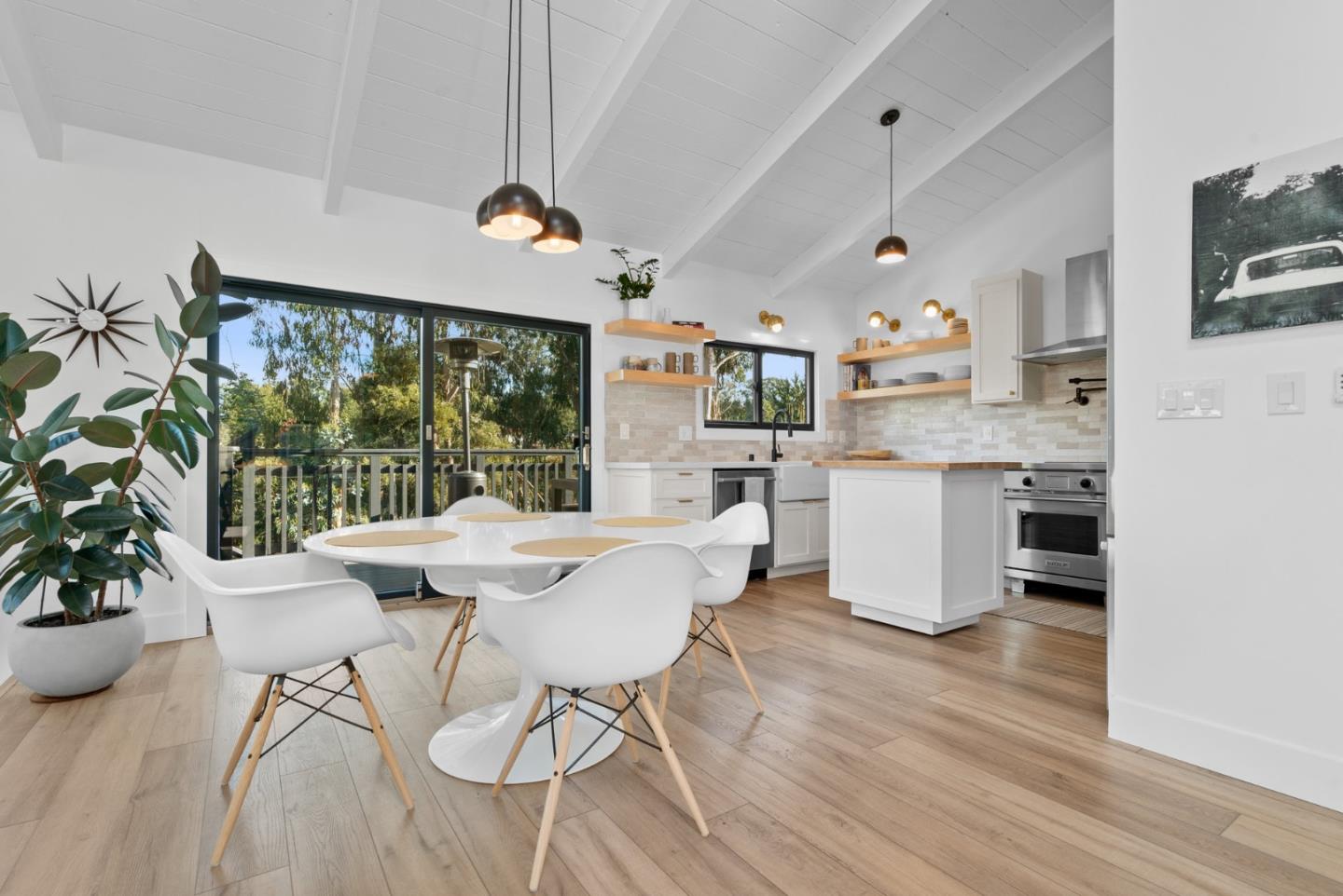 409 Townsend Drive Aptos, CA 95003 - Photo 13 of 43 a kitchen with stainless steel appliances kitchen island granite countertop a table chairs sink and cabinets
