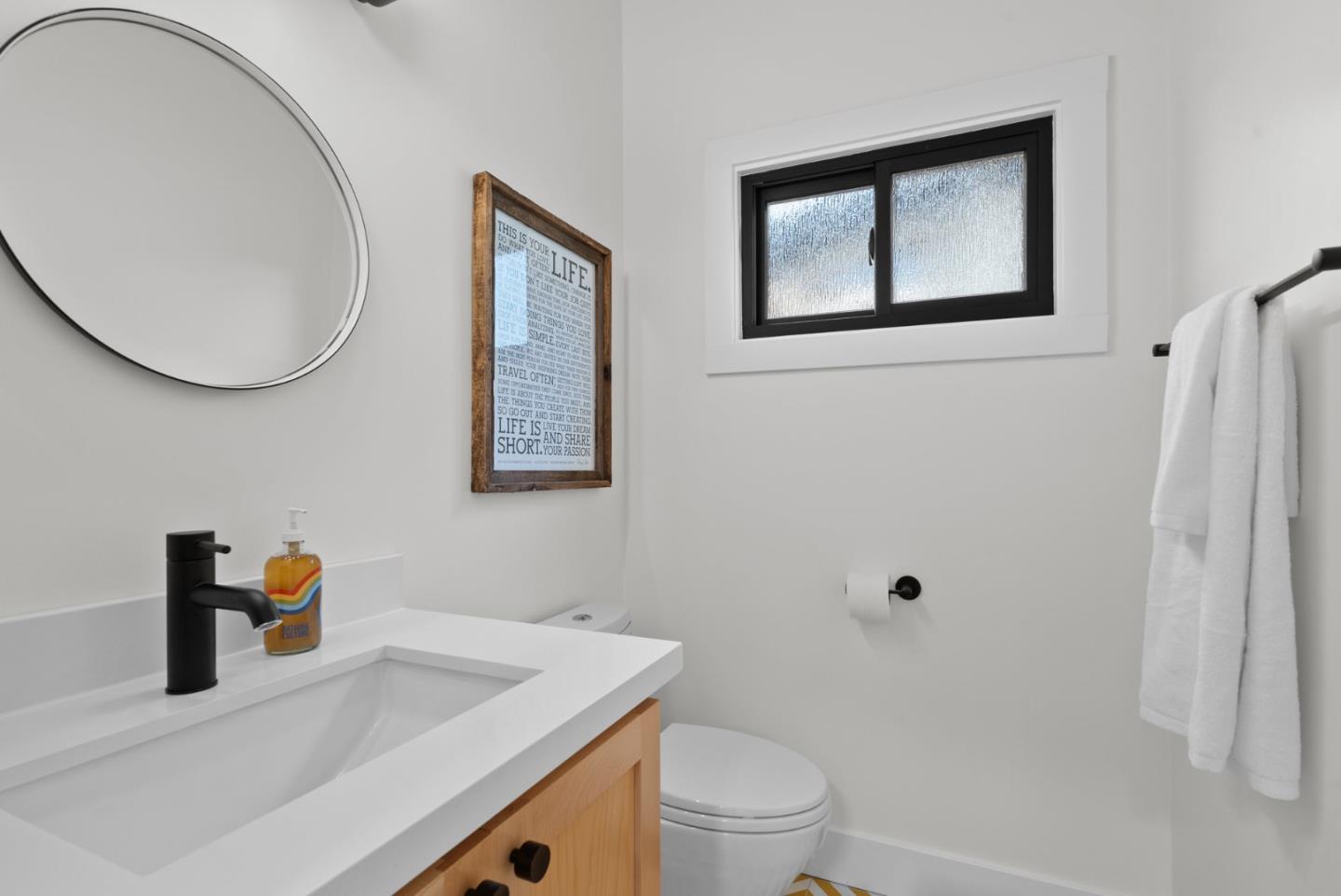 409 Townsend Drive Aptos, CA 95003 - Photo 24 of 43 a bathroom with a sink a toilet and a mirror