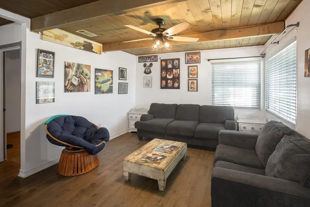 a living room with furniture and a window