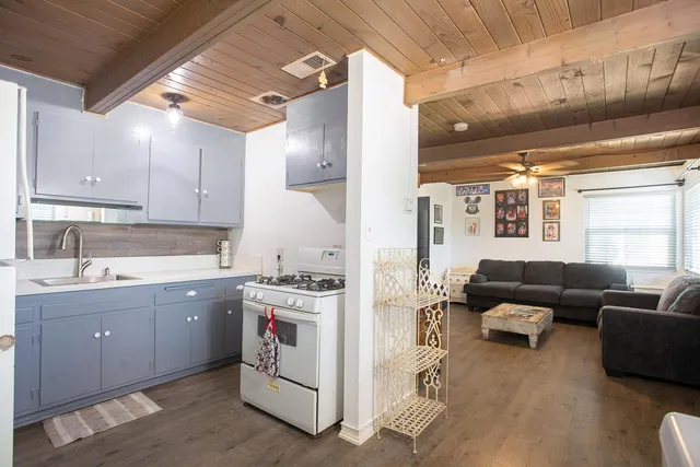 a view of a kitchen with furniture and a window