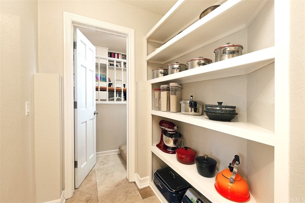 7 Windsor Newport Beach, CA 92660 - Photo 16 of 40 a kitchen with a refrigerator and lots of clutter