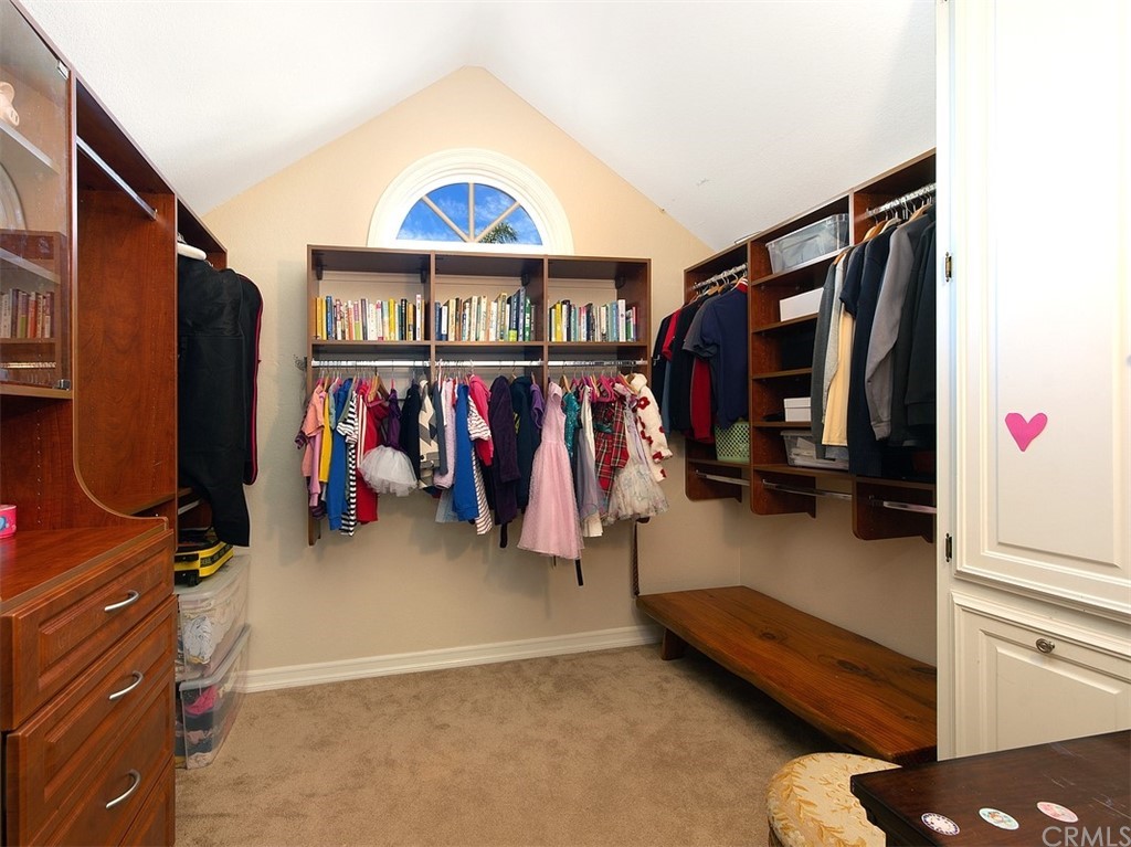 7 Windsor Newport Beach, CA 92660 - Photo 25 of 40 a view of walk in closet with clothes and shoes