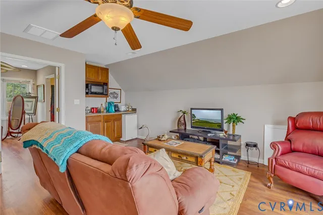 a bedroom with furniture and a book shelf