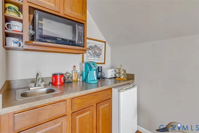 a kitchen with a sink and cabinets