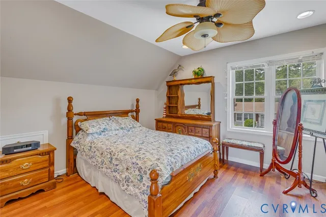 a bed room with a bed and a chandelier