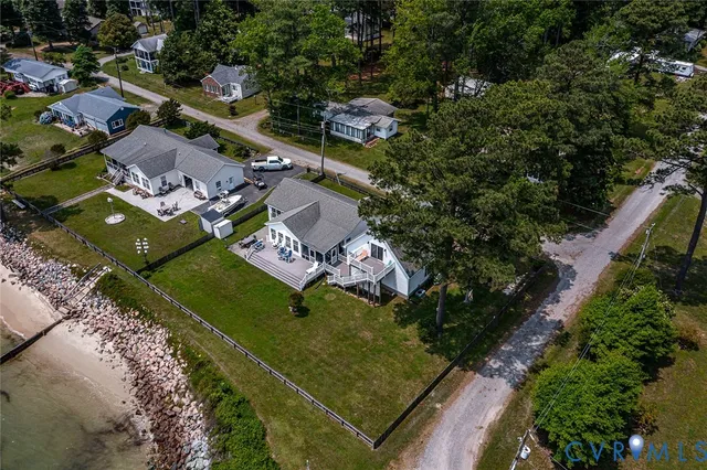 an aerial view of a residential houses with outdoor space