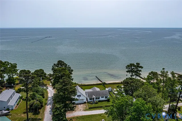 an aerial view of a house with a lake view