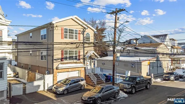 a view of a cars park in front of house