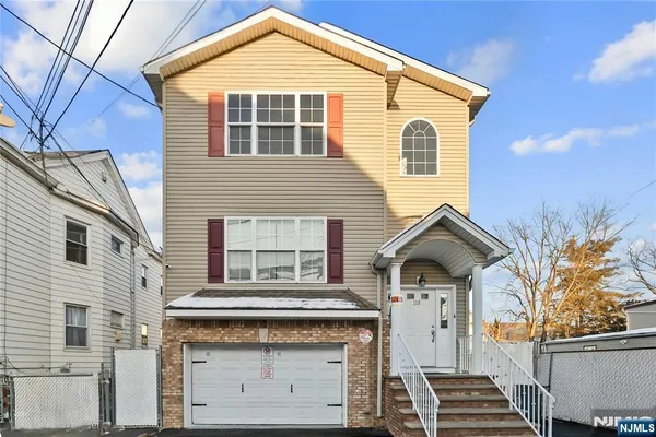 a front view of a house with a garage