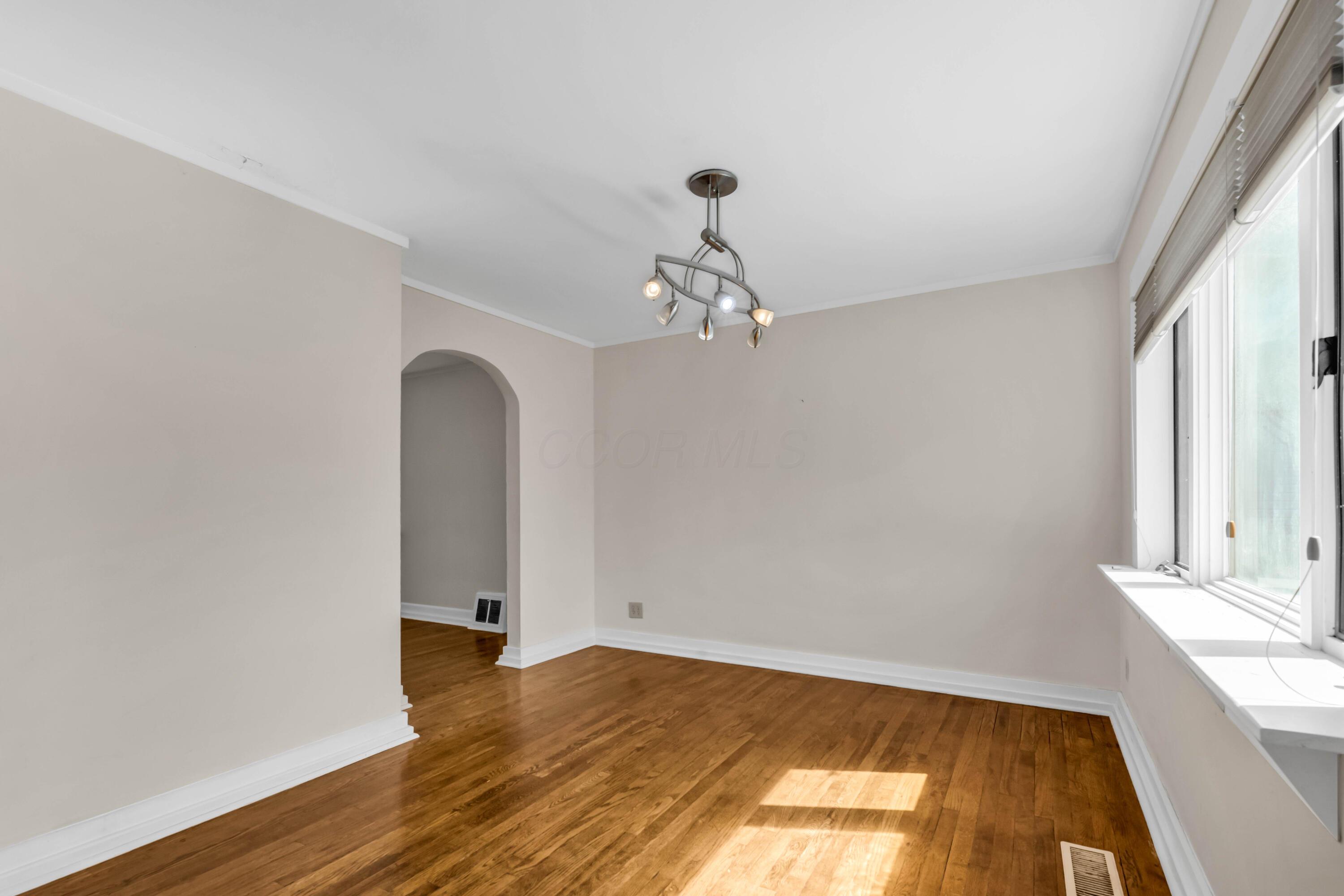 2033 Zollinger Road Columbus, OH 43221 - Photo 13 of 44 • Hardwood flooring
• Ivory painted walls
• Chandelier