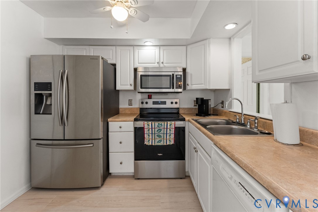 1760 Gloucester Road Gloucester Point, VA 23062 - Photo 17 of 47 Kitchen featuring white cabinetry, stainless steel
