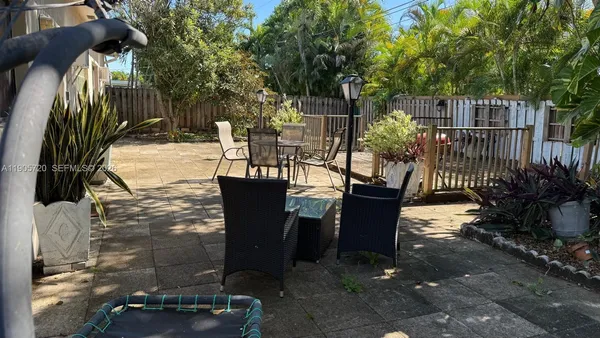 a view of a balcony with chairs