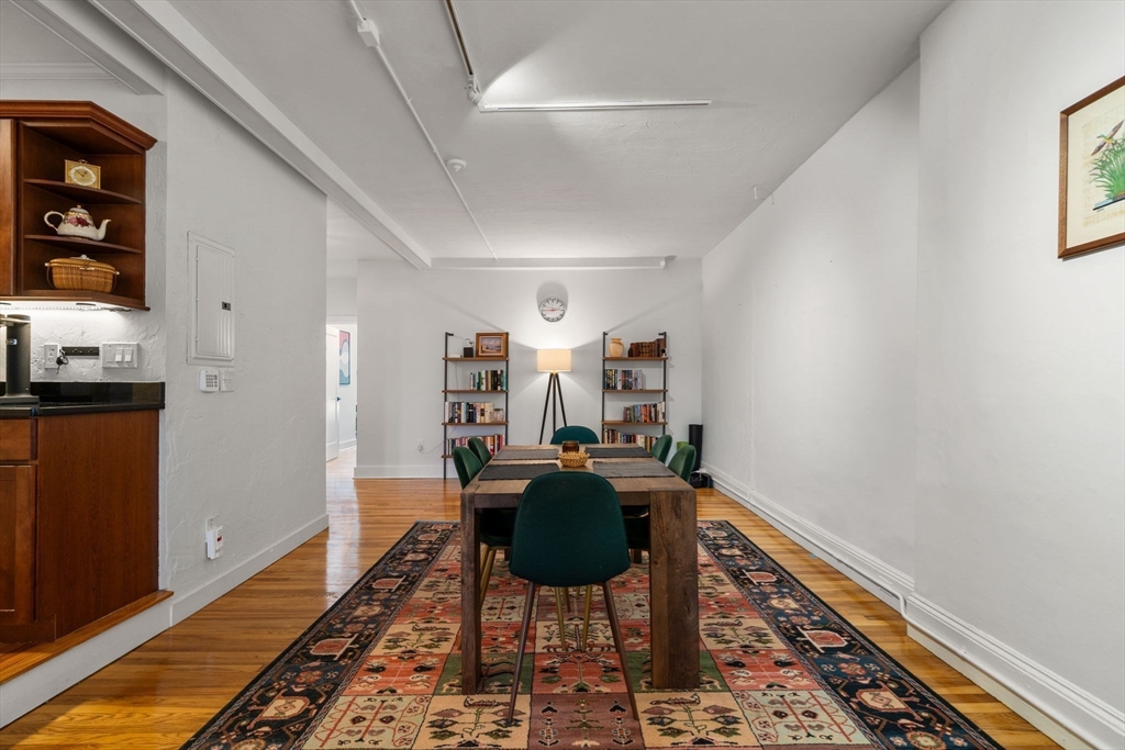 63 Maverick Square, Unit 5 Boston, MA 02128 - Photo 13 of 23 a living room with furniture and a rug