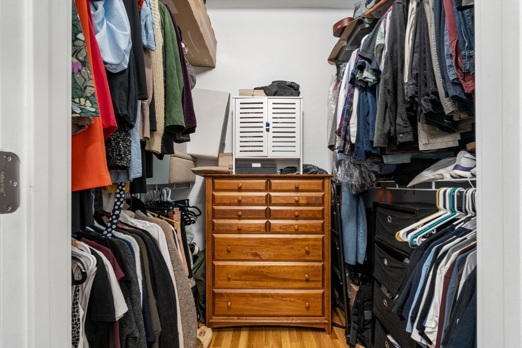 63 Maverick Square, Unit 5 Boston, MA 02128 - Photo 18 of 23 a view of walk in closet with clothes and shoes