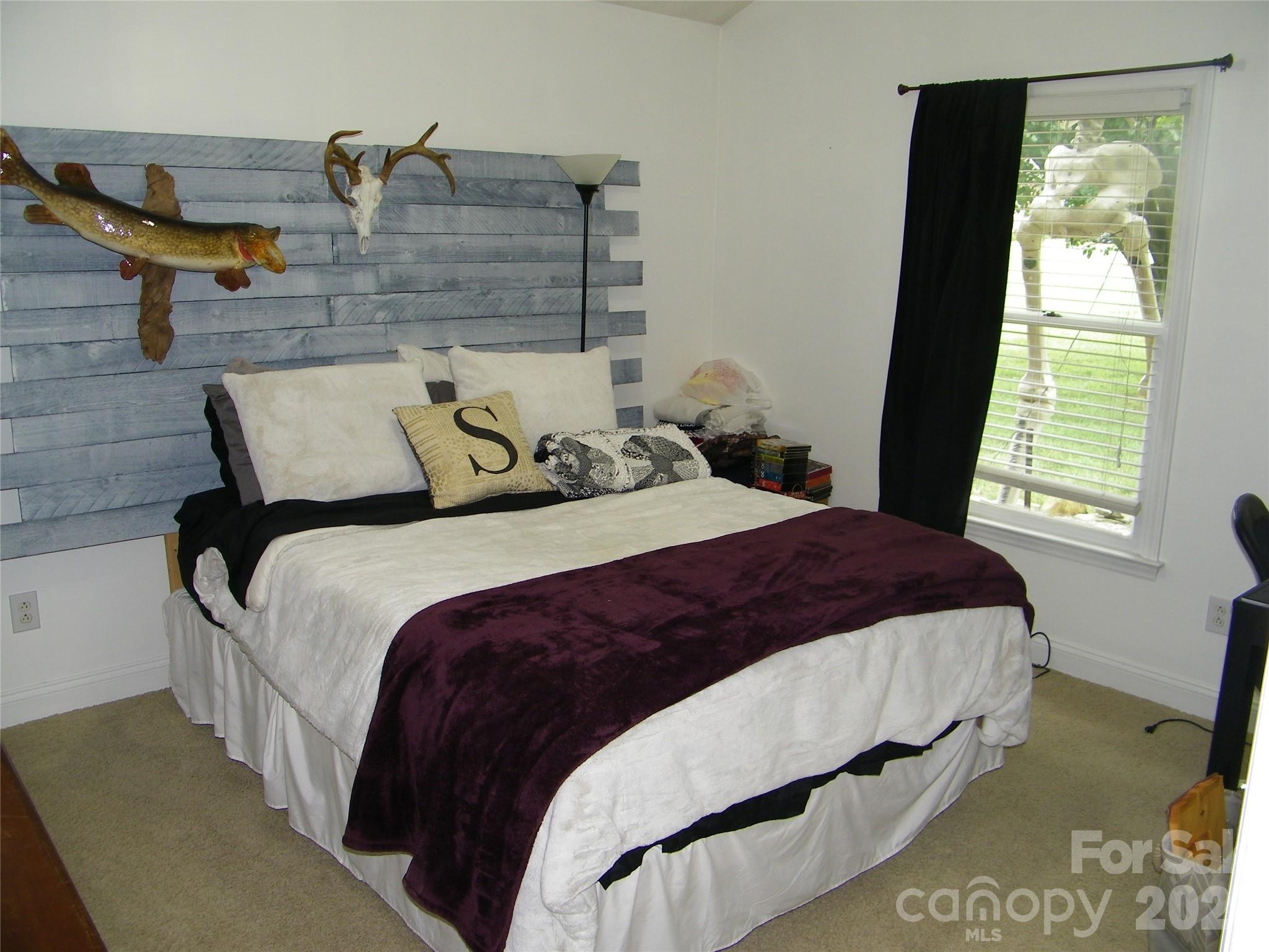 609 Redah Avenue Locust, NC 28097 - Photo 21 of 37 a bedroom with a bed and window