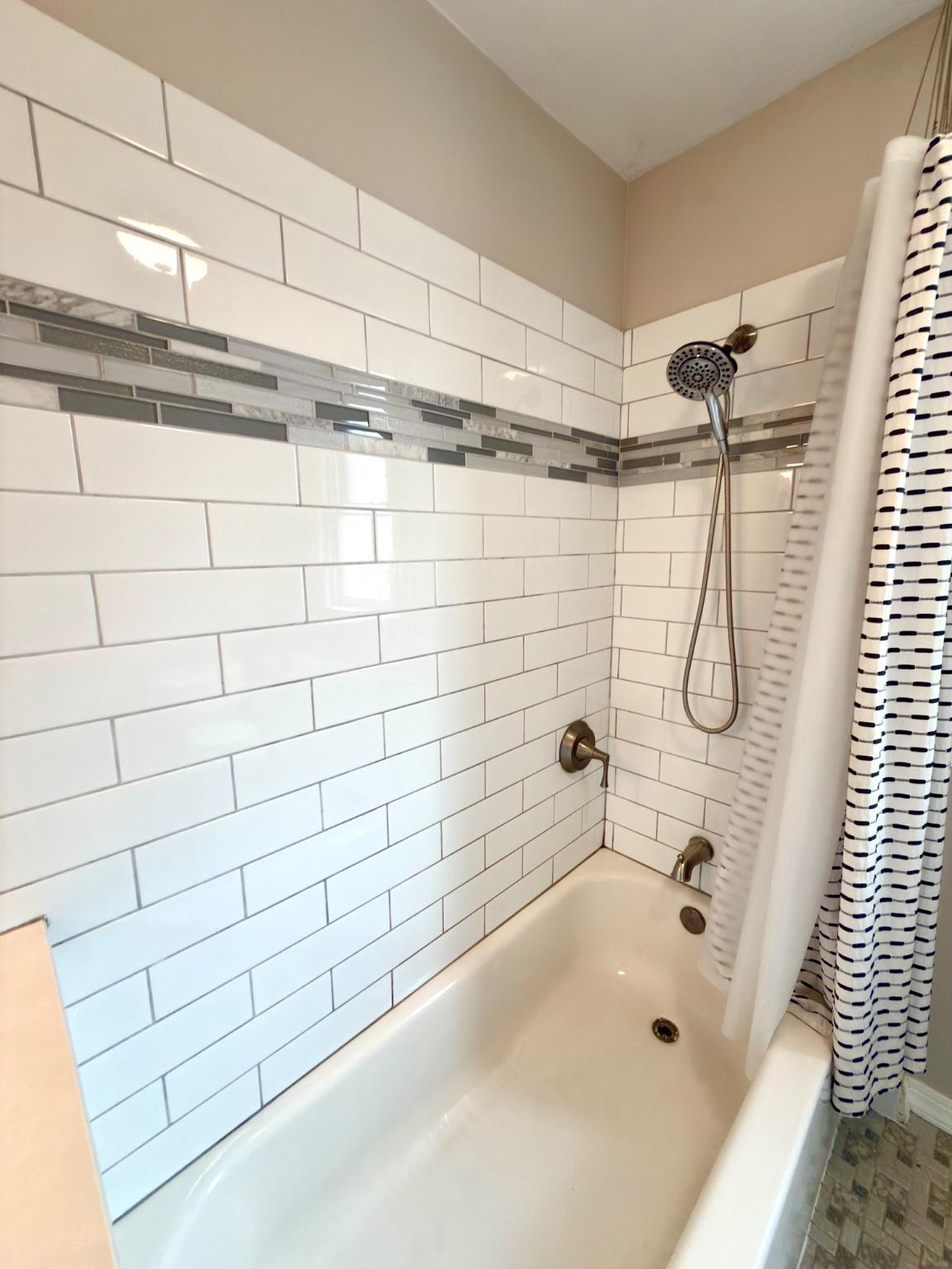 1723 Chelsea Road Elkins Park, PA 19027 - Photo 24 of 38 a bathroom with a bathtub and shower