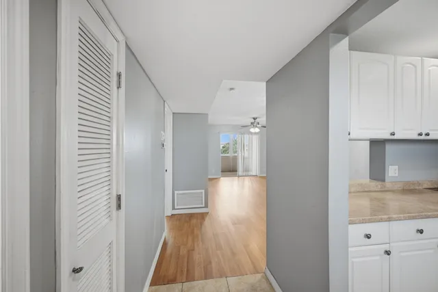 a view of a kitchen from the hallway