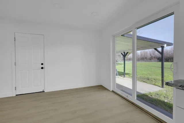 a view of an empty room and window