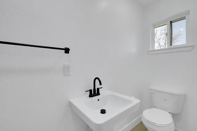 a bathroom with a sink and mirror