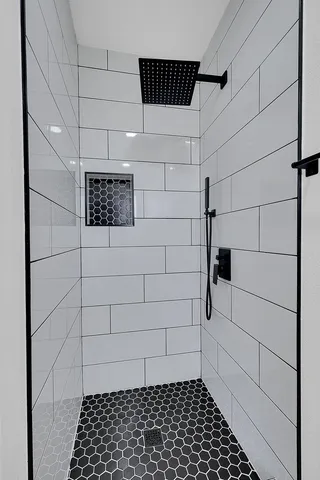 a living room with a couch and wooden floor