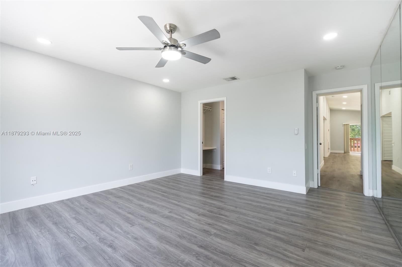 6211 Southwest 116th Place, Unit C22 Miami, FL 33173 - Photo 13 of 33 a view of an empty room with wooden floor