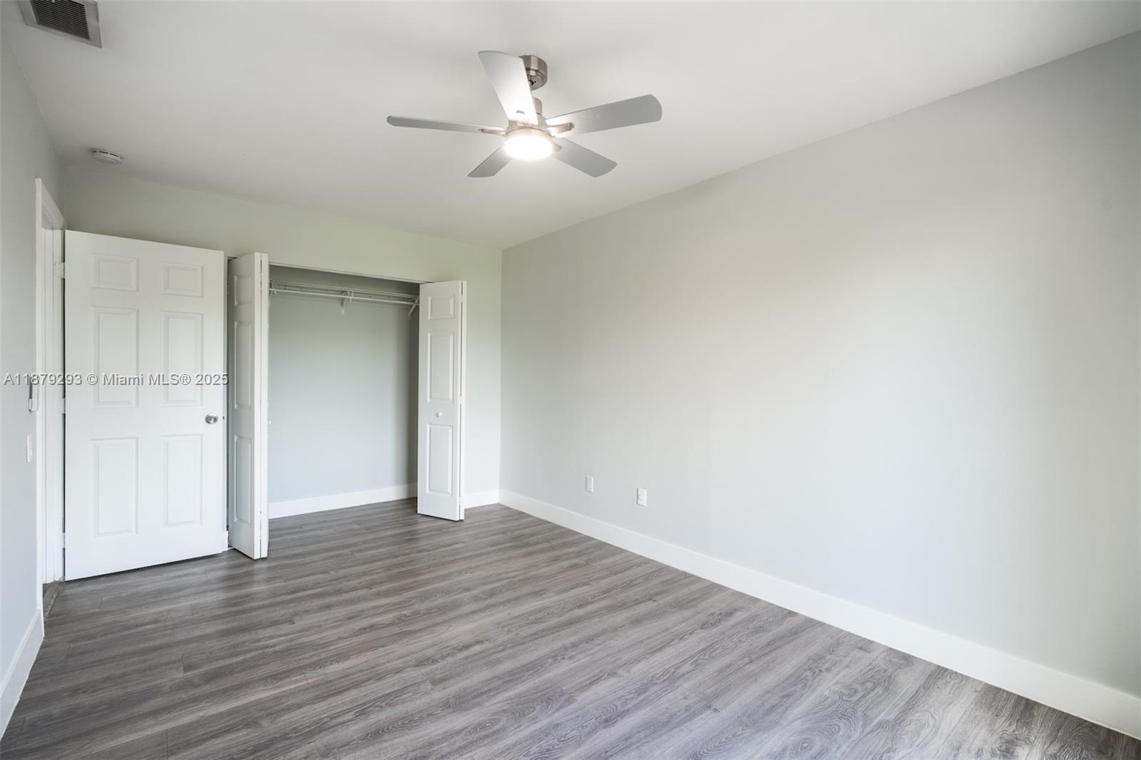 6211 Southwest 116th Place, Unit C22 Miami, FL 33173 - Photo 19 of 33 a view of an empty room with wooden floor