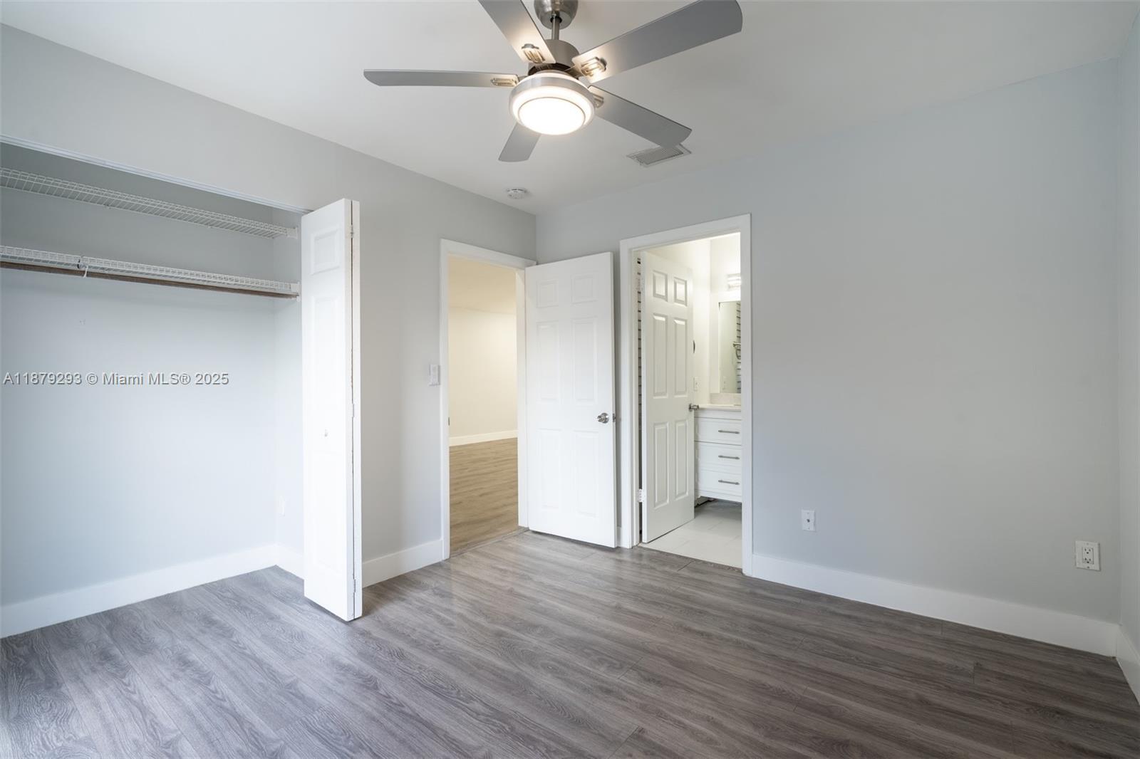 6211 Southwest 116th Place, Unit C22 Miami, FL 33173 - Photo 25 of 33 a view of an empty room with wooden floor