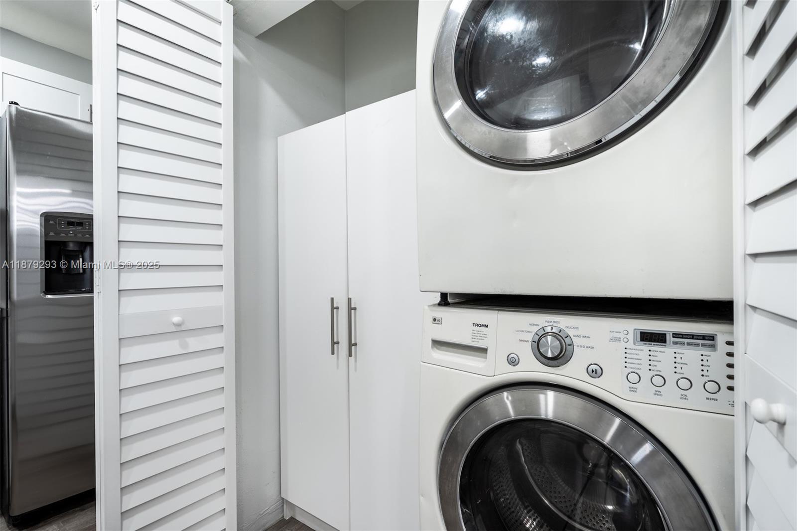 6211 Southwest 116th Place, Unit C22 Miami, FL 33173 - Photo 27 of 33 a view of a hallway with washer and dryer