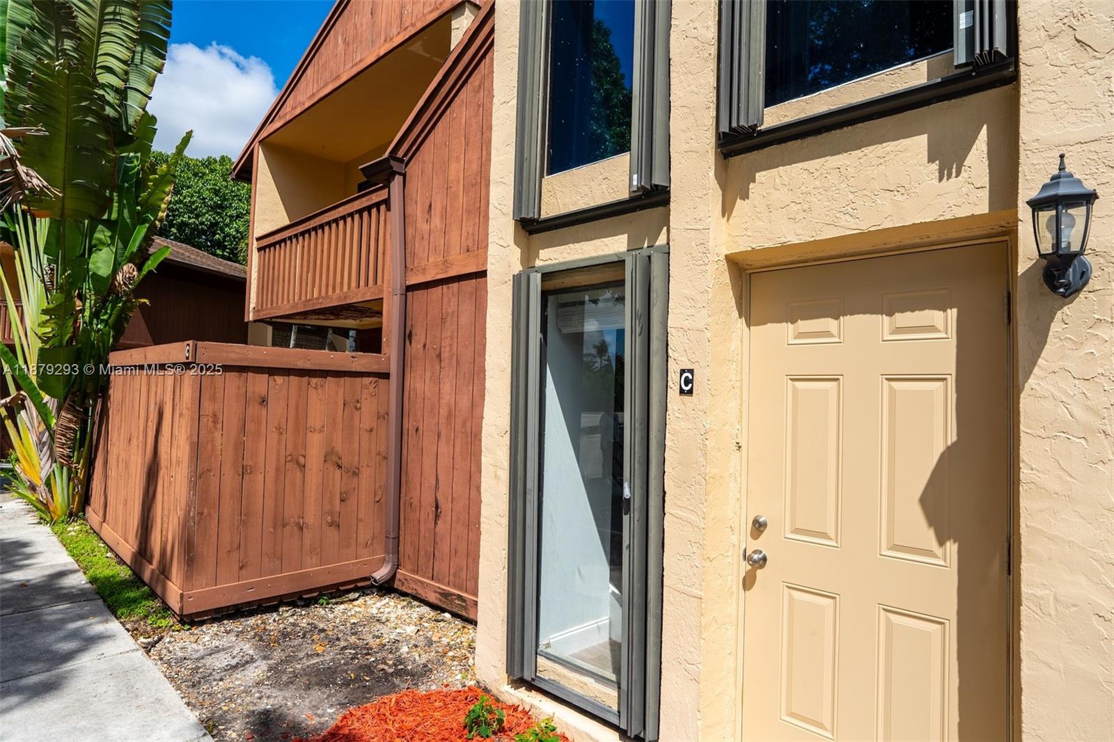 6211 Southwest 116th Place, Unit C22 Miami, FL 33173 - Photo 29 of 33 a view of a door and a window