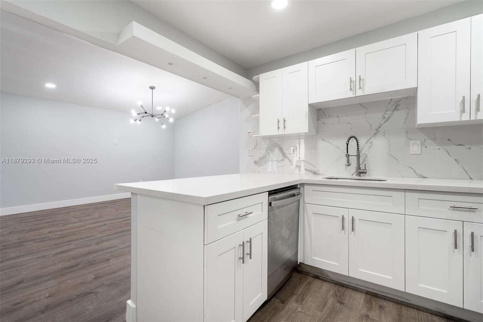 6211 Southwest 116th Place, Unit C22 Miami, FL 33173 - Photo 5 of 33 a kitchen with white cabinets and sink