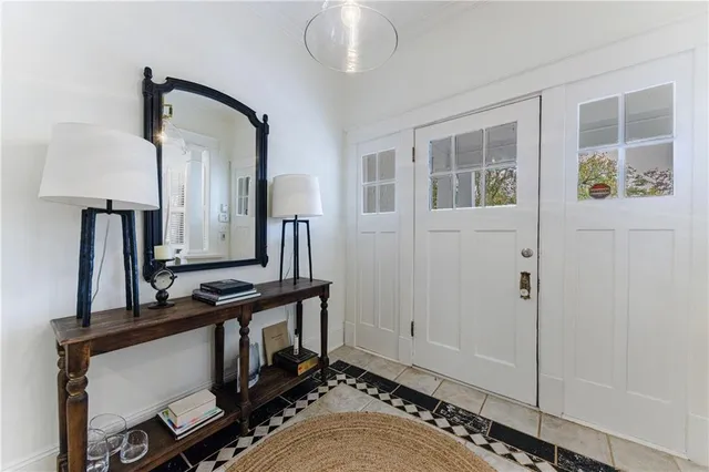 a view of hall way with mirror