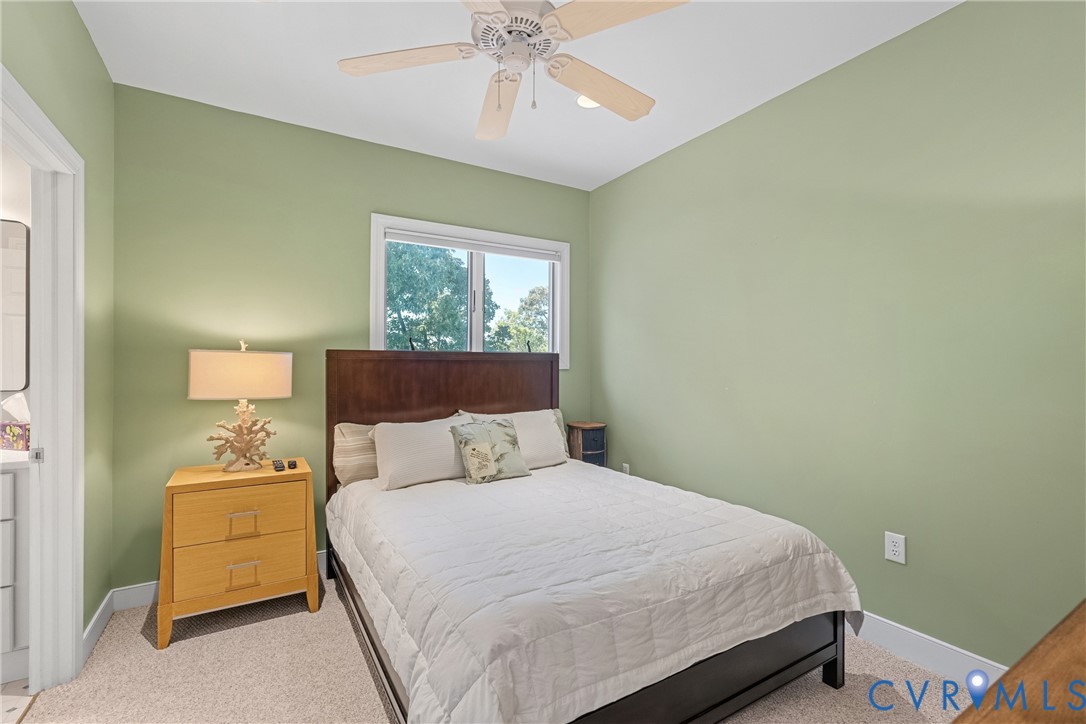 447 Tranquility Road Reedville, VA 22539 - Photo 44 of 82 Room featuring a ceiling fan, window with exterior