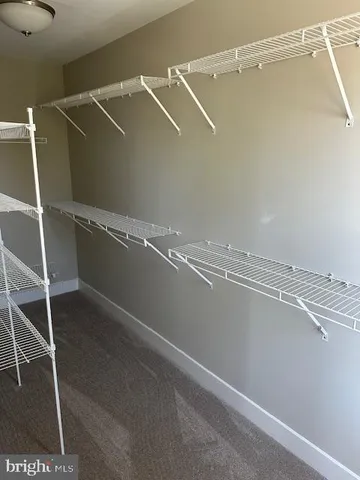 a view of a room with racks on the wall