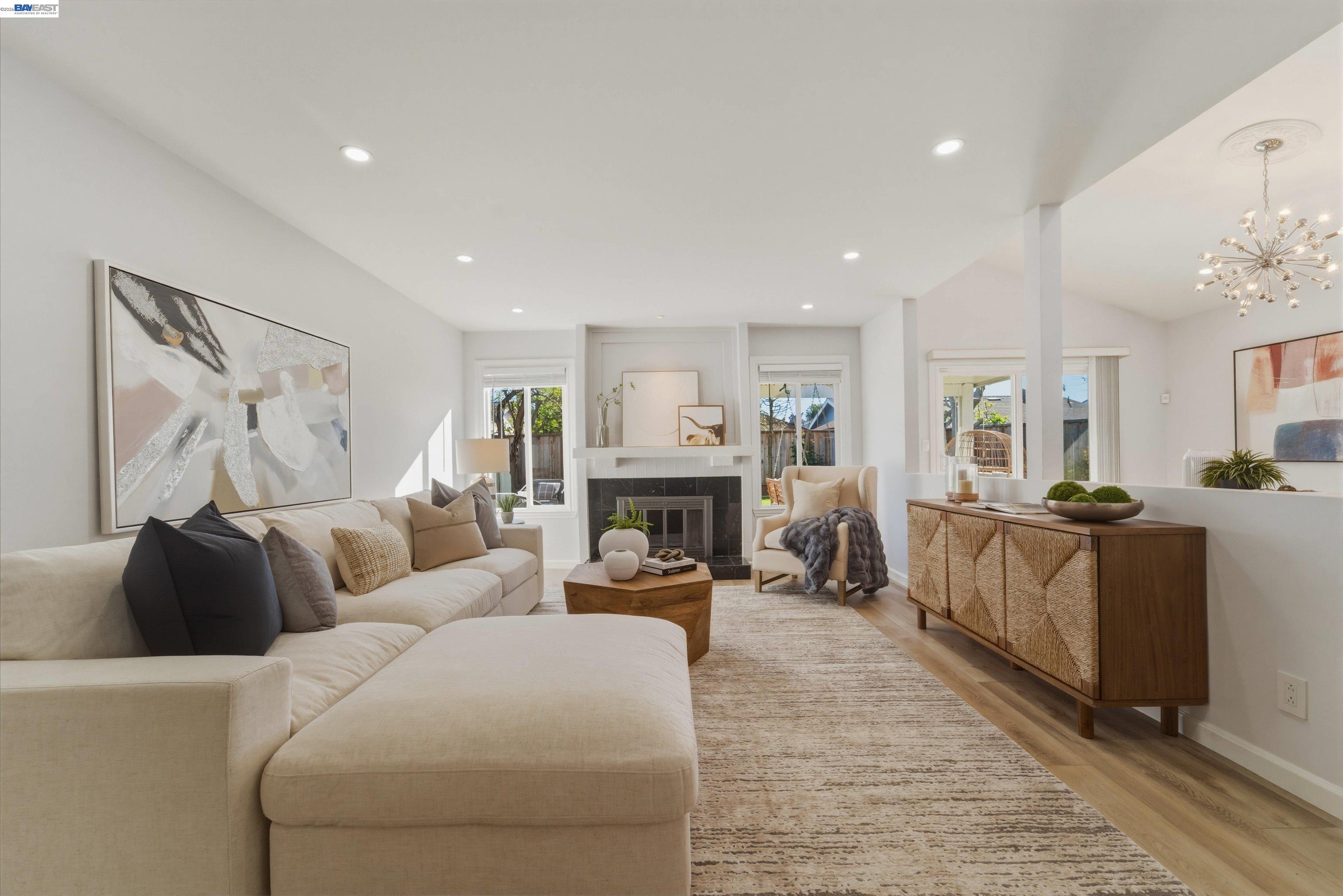 a living room with furniture and a fireplace