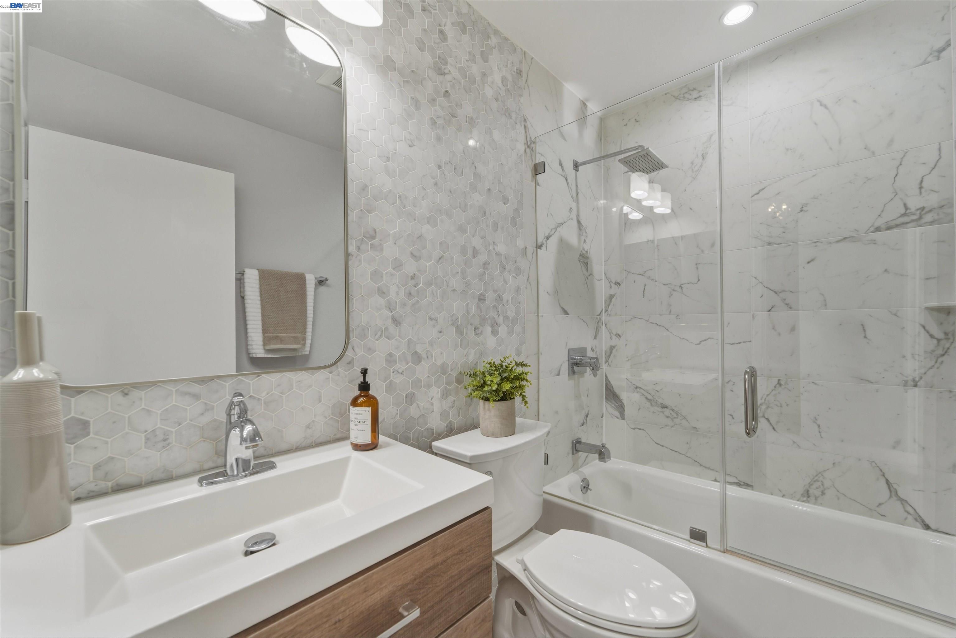 32471 Lake Ree Street Fremont, CA 94555 - Photo 13 of 31 a bathroom with a sink toilet a bathtub and shower