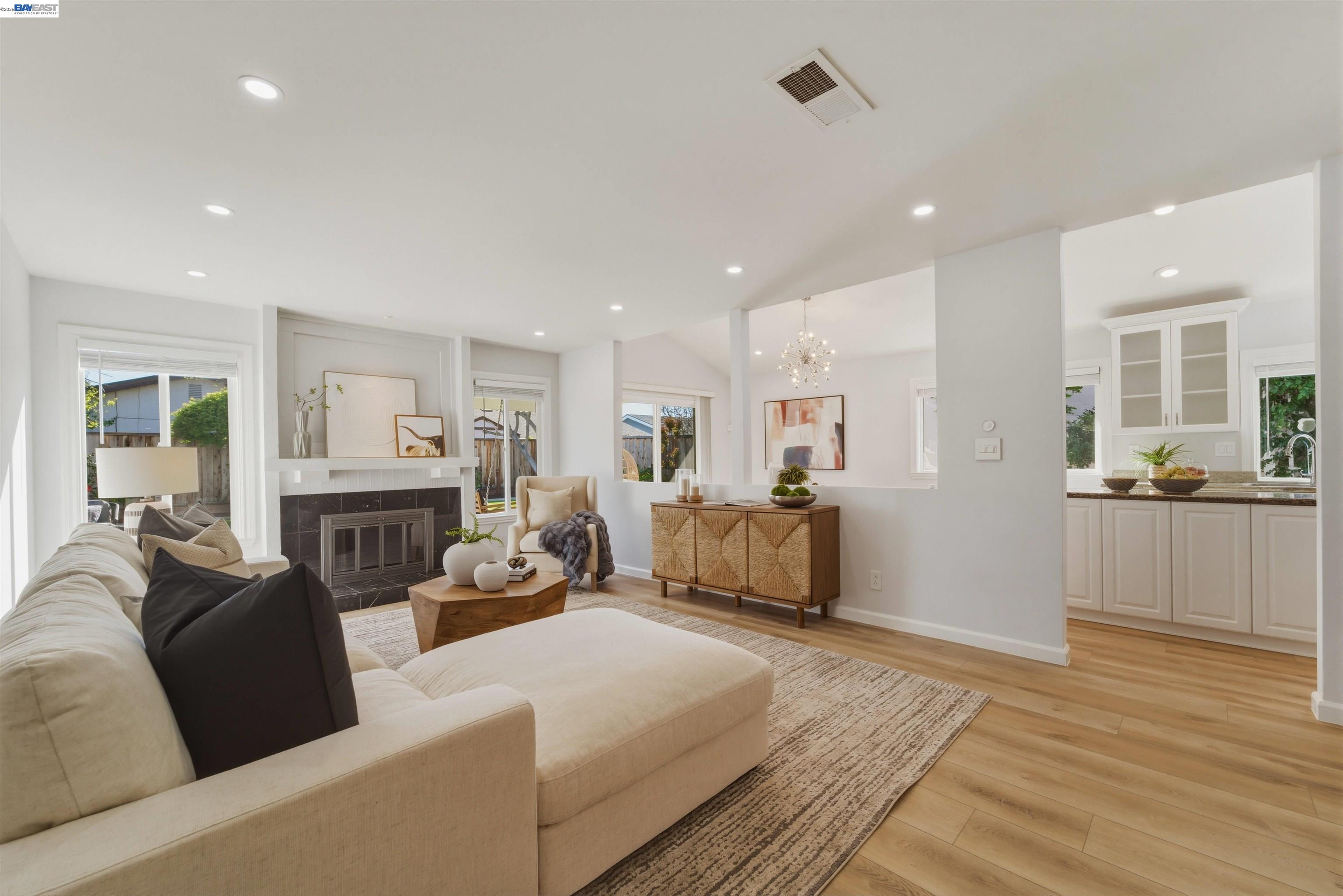 32471 Lake Ree Street Fremont, CA 94555 - Photo 2 of 31 a large bedroom with furniture and a wooden floor