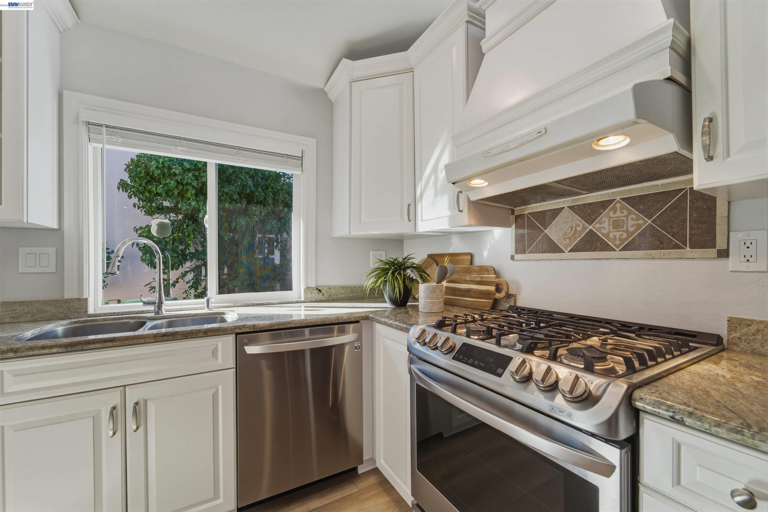 32471 Lake Ree Street Fremont, CA 94555 - Photo 6 of 31 a kitchen with a stove and a sink