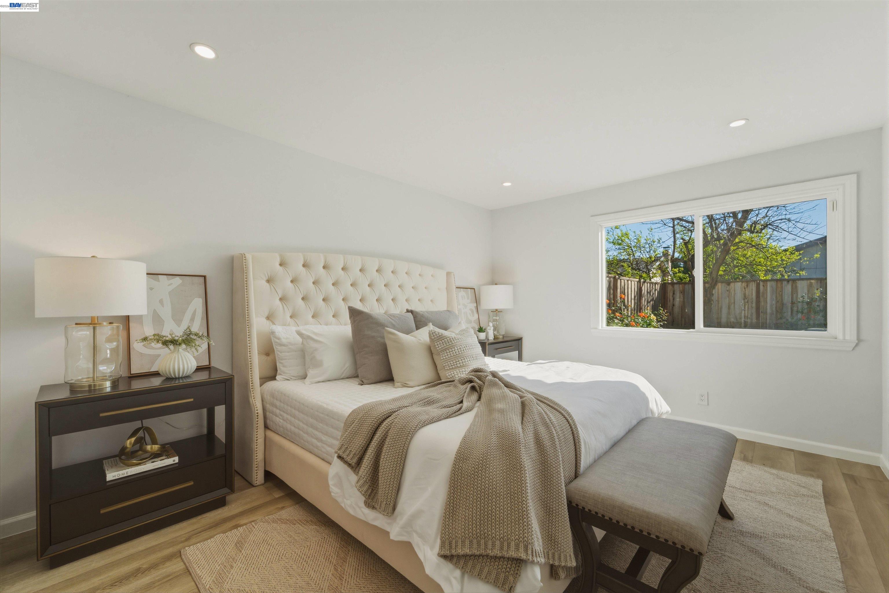 32471 Lake Ree Street Fremont, CA 94555 - Photo 9 of 31 a bedroom with a bed and a window