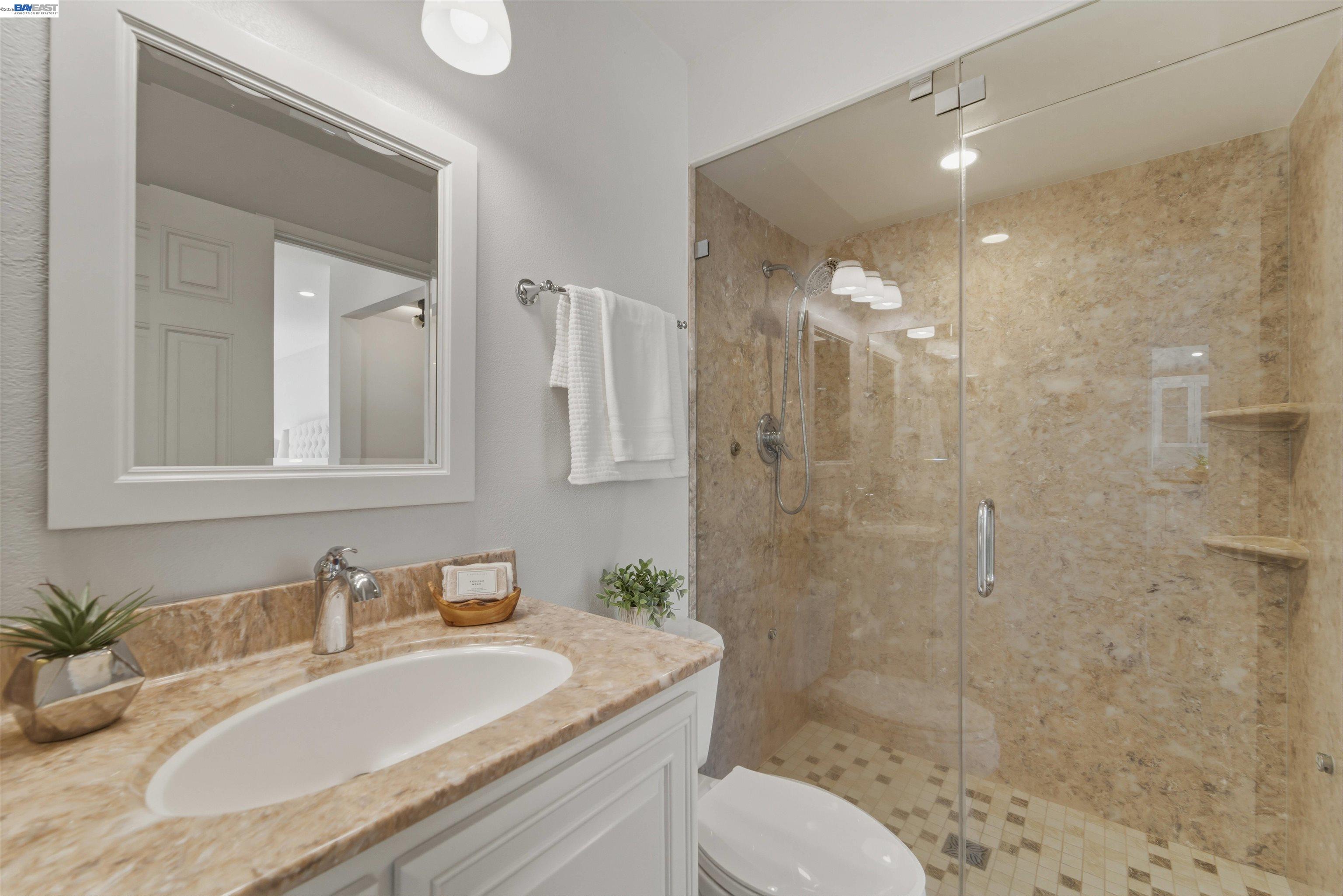 32471 Lake Ree Street Fremont, CA 94555 - Photo 10 of 31 a bathroom with a granite countertop sink toilet and shower