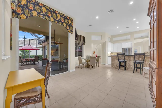 a bed room with a bed a television and a large window