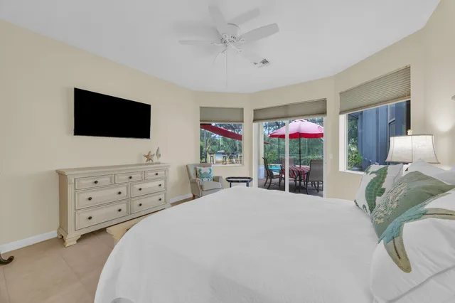 a bed room with a bed and a chair