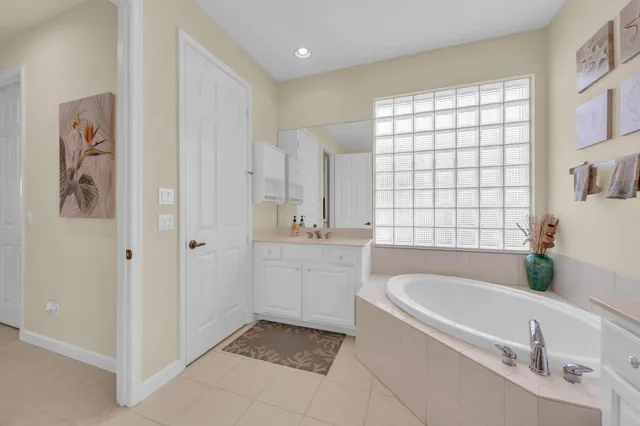 a kitchen with a sink and a mirror