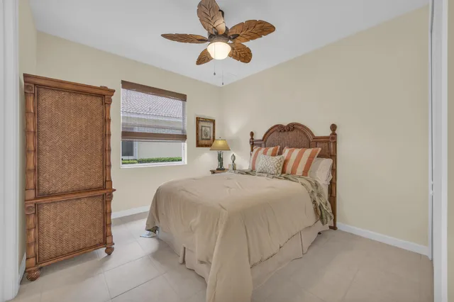 a spacious bedroom with a bed and a window