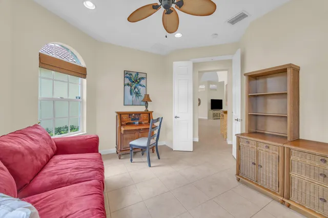a bathroom with a sink mirror and toilet