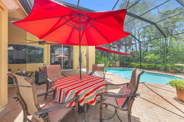 an aerial view of residential house with outdoor space and swimming pool